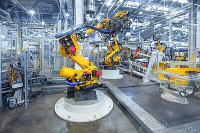 Large industrial factory building with robots